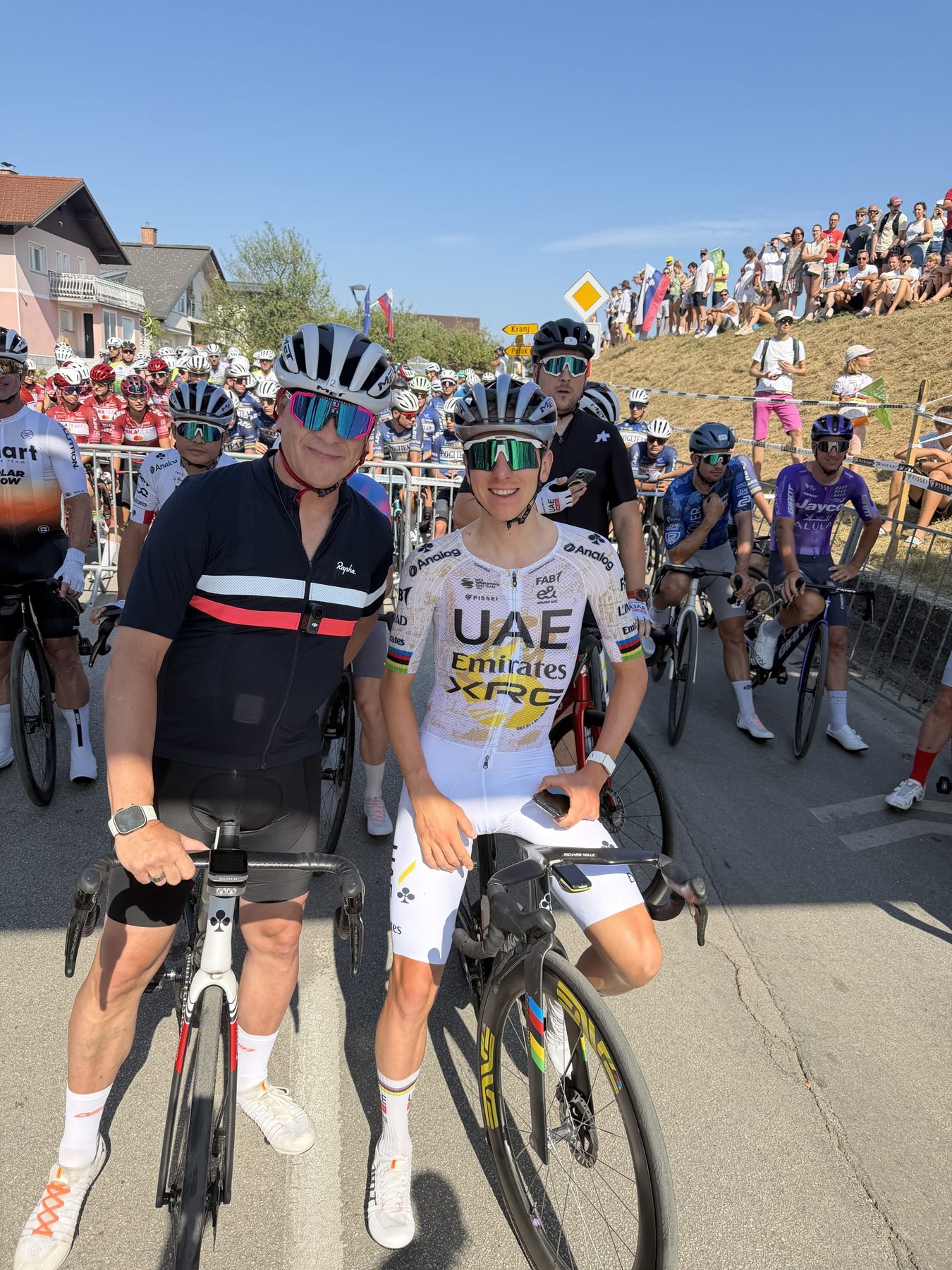 Karl McDonnell and Tadej Pogačar together on their bikes at a cycling event