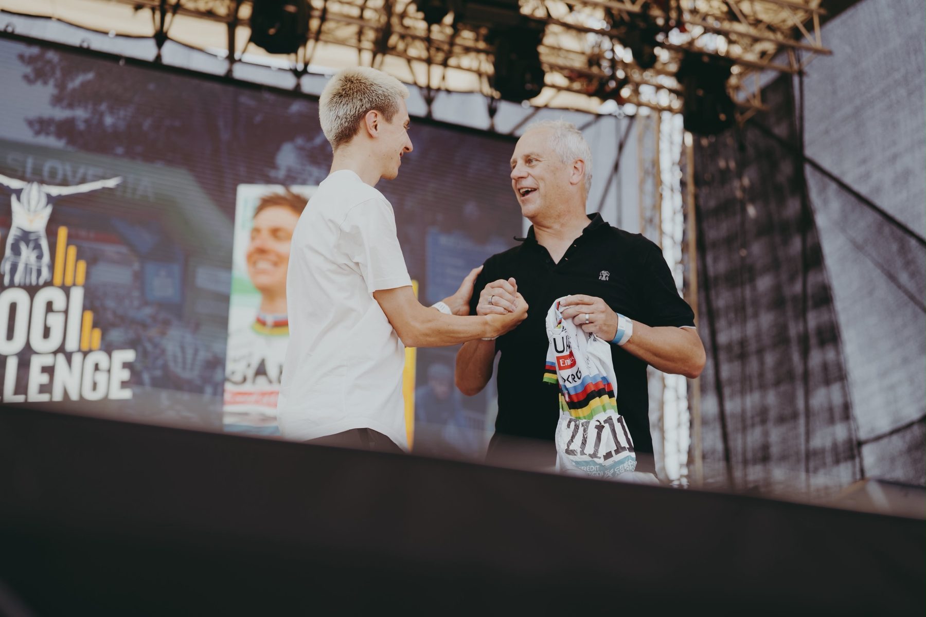 Karl McDonnell and Tadej Pogačar together during the Milano-Sanremo jersey presentation