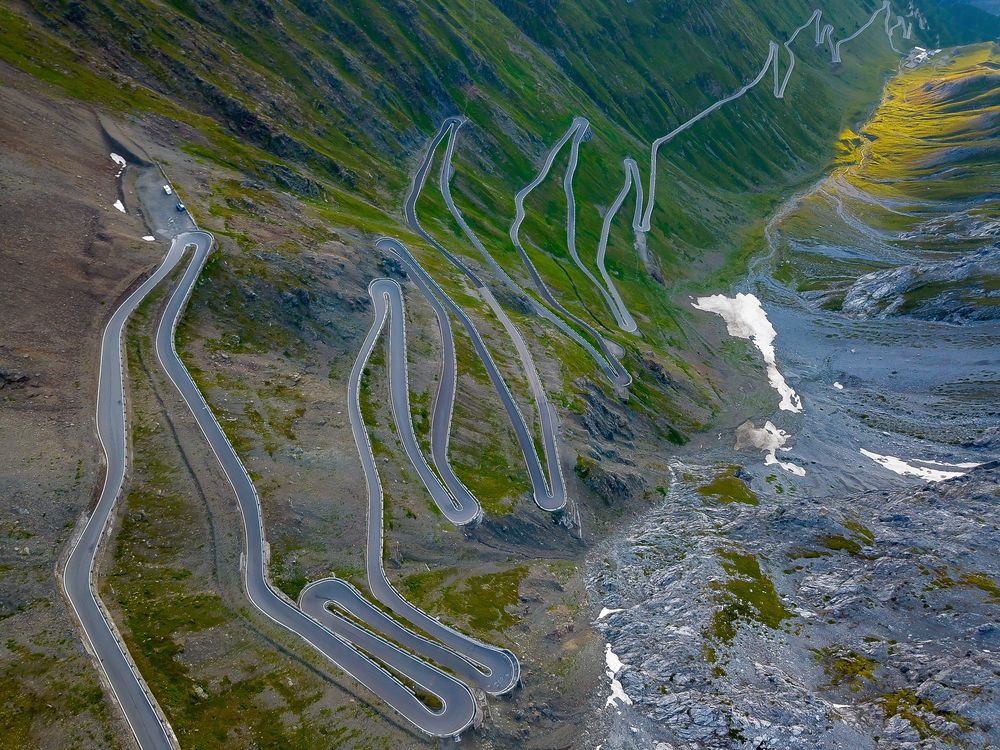 Switchbacks climbing an alpine pass, from above
